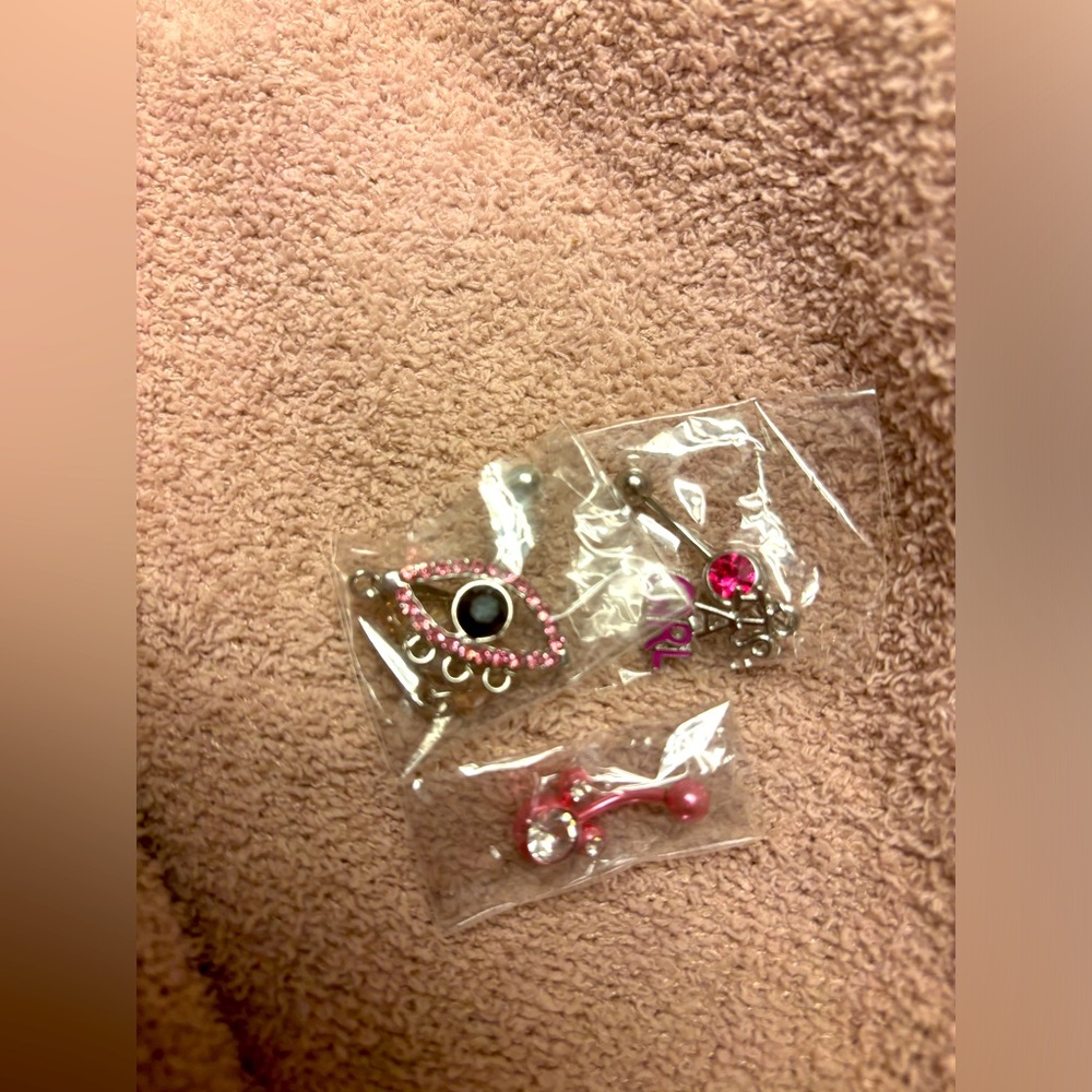 Pink sterling silver belly button ring. Size: standard 14 gauge